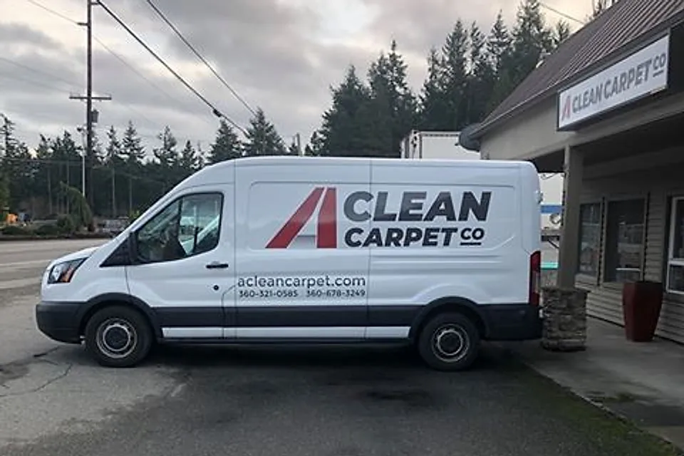 The A Clean Carpet Co van, signwritten with the company logo and phone numbers, parked outside the company shop